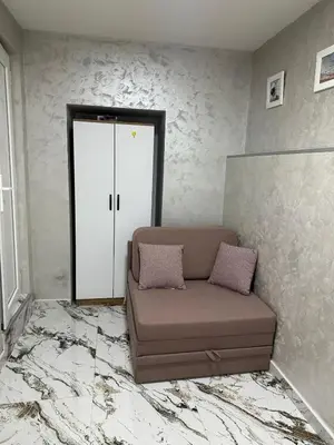 a living room with a couch and a door at Dream 10 in Belgrade