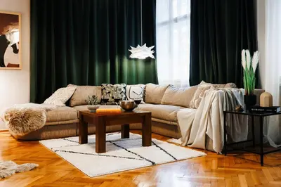 a living room with a couch and a table at Fireplace Retreat 115m2 with Balcony Old Town in Belgrade