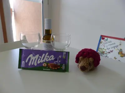 a table with a bottle of wine and two wine glasses at Tackica 13 Apartment in Belgrade