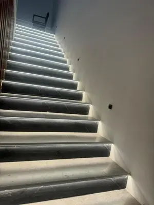 a staircase in a building with a bench on it at Infinity Lux Residence in Novi Banovci
