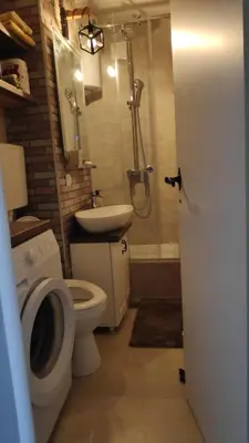 a bathroom with a shower and a toilet and a sink at 14th Heaven Apartment in Belgrade