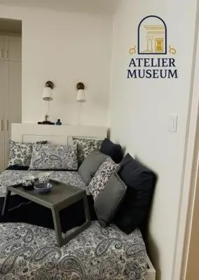 a living room with a couch and a table at Atelier Museum in Belgrade