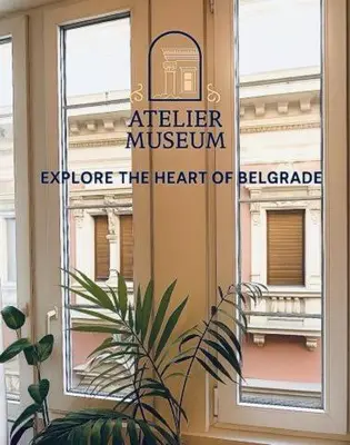 a sign on the side of a building with a plant at Atelier Museum in Belgrade