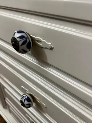 a drawer with two blue and white knobs on it at Atelier Museum in Belgrade