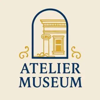 a logo for a museum with a column at Atelier Museum in Belgrade