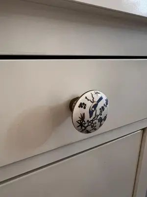 a white drawer with a blue and white knob at Atelier Museum in Belgrade