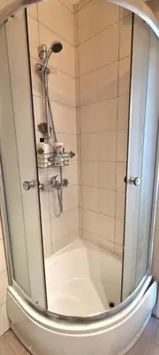 a shower with a glass door in a bathroom at Mileshevska Studio in Belgrade