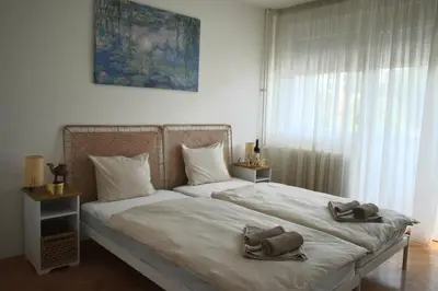 a bedroom with a bed with two towels on it at Apartman Play in Belgrade