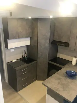 a small kitchen with a sink and a counter at Beograd stan na dan in Novi Beograd