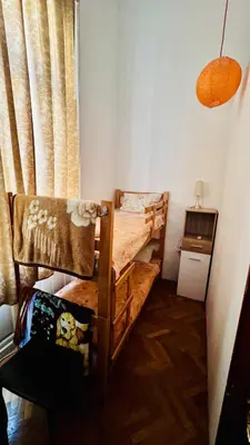 a bedroom with a wooden bunk bed in a room at BW Hostel in Belgrade
