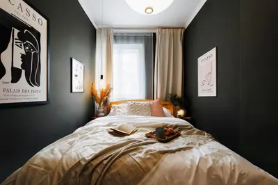 a bedroom with a bed and a window at Harmonic Nest 3min to Republic Square Renovated in Belgrade