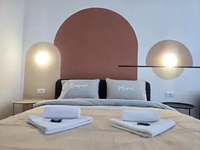 a bedroom with a bed with two towels on it at Boneca apartment in Belgrade
