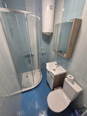 a bathroom with a toilet and a shower and a sink at Sunny Lux Apartment Terazije in Belgrade