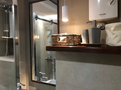 a bathroom with a sink and a mirror at Apartment Nevena 3 in Belgrade