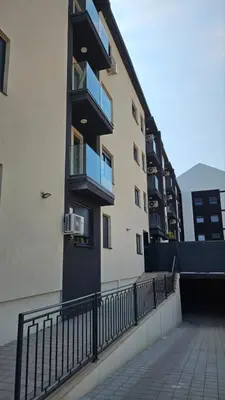 a building with balconies on the side of it at Apartman Mima in Inđija
