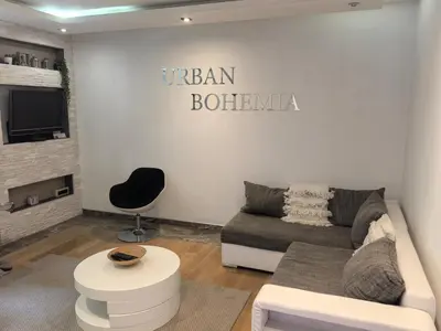 a living room with a couch and a chair at Kalemegdan park & Zoo - City center in Belgrade