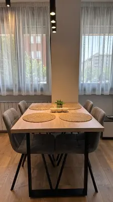 a dining room table with chairs around it at District 21 in Belgrade