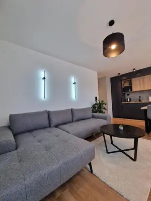 a living room with a couch and a table at District 21 in Belgrade
