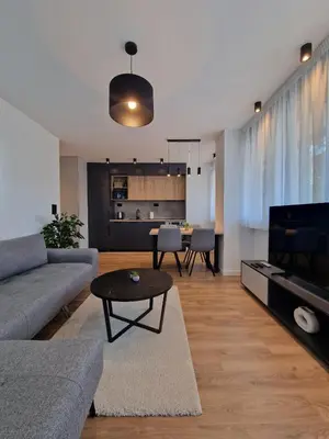 a living room with a couch and a table at District 21 in Belgrade