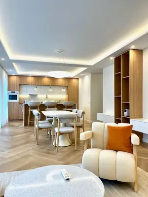 a kitchen and dining room with a table and chairs at Luxury apartment in the heart of Vračar in Belgrade