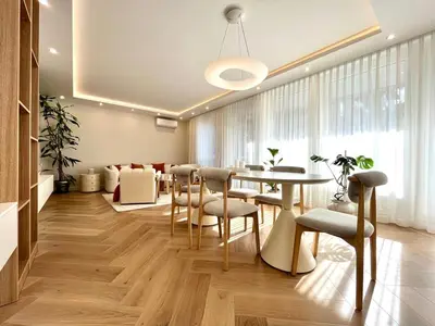 a dining room with a table and chairs at Luxury apartment in the heart of Vračar in Belgrade