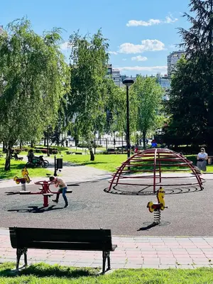 a park with a playground with a roller coaster at Luxury apartment in the heart of Vračar in Belgrade