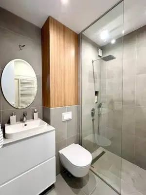 a bathroom with a toilet and a sink and a shower at Luxury apartment in the heart of Vračar in Belgrade