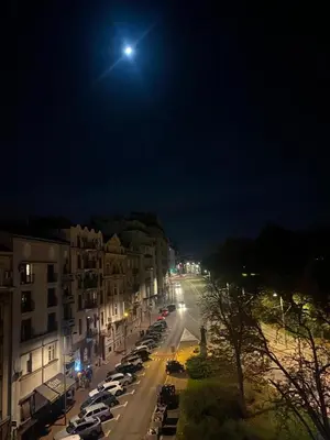 a city street at night with a full moon at The View That Never Gets Old - Kalemegdan in Belgrade