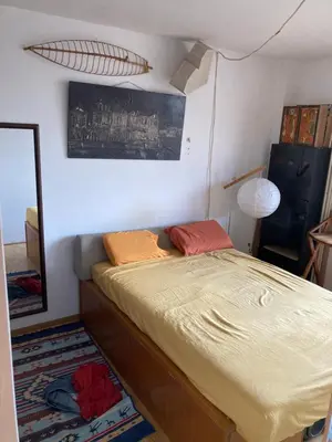 a bedroom with a bed and a large mirror at Krov in Belgrade
