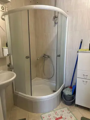 a shower with a glass door in a bathroom at Cozy two bedroom in Belgrade in Belgrade