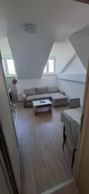 a living room with a couch and a table at Bingo's apartman in Belgrade