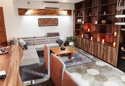 a living room with a couch and a table at House therapy in Sremčica
