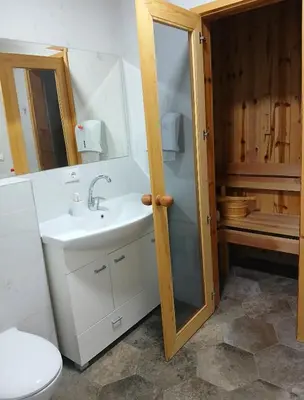 a bathroom with a sink and a toilet and a shower at House therapy in Sremčica