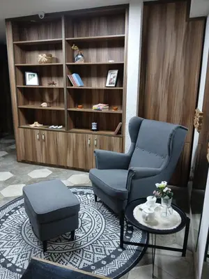 a living room with two chairs and a table at House therapy in Sremčica