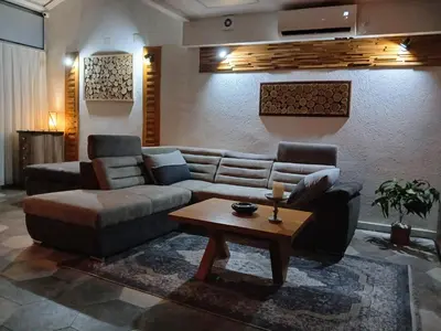 a living room with a couch and a coffee table at House therapy in Sremčica