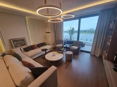 a living room with a couch and a table at Exclusive apartman BW Terraces in Belgrade