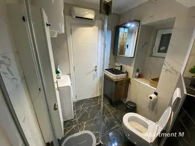 a bathroom with a toilet and a sink at Apartman M in Belgrade