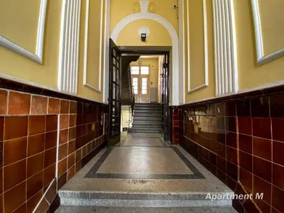 an empty hallway of a building with stairs at Apartman M in Belgrade