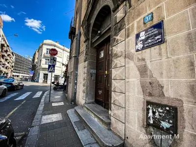 a building with a door on the side of a street at Apartman M in Belgrade