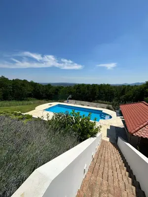 a view of a swimming pool from a house at Hacienda Koviona in Parcani