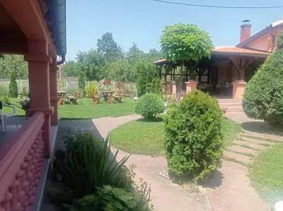 a view of a garden from a house at Vintage Village Serbia
