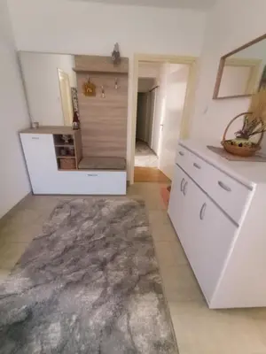 a kitchen with white cabinets and a counter at Vintage Village Serbia