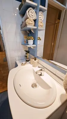 a bathroom with a white sink and a mirror at Old Town View Apartment in Belgrade