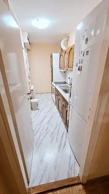 a kitchen with a refrigerator and a sink at Old Town View Apartment in Belgrade