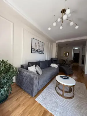 a living room with a couch and a table at DILL apartman Arandjelovac in Arandjelovac