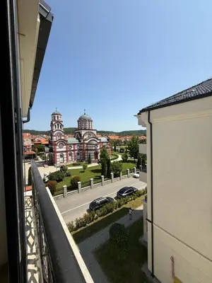 a view of a street from a balcony of a building at DILL apartman Arandjelovac in Arandjelovac