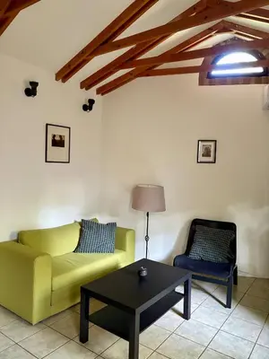 a living room with a couch and a coffee table at Tiny Home L&B in Belgrade