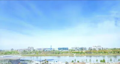 a view of a river with a city in the background at Arkadija Lux Apartment River And Tower View in Belgrade