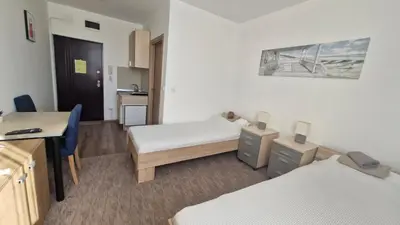 a hospital room with two beds and a desk at Banjica 202 in Voždovac