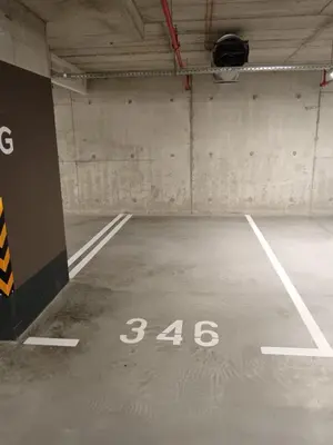 an empty parking garage with the number at Belgrade Waterfront Shine Quartet 3 in Belgrade